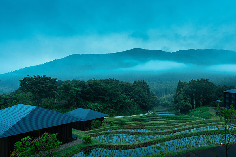 kengo kuma scatters hot spring hotel across sculpted rice terraces