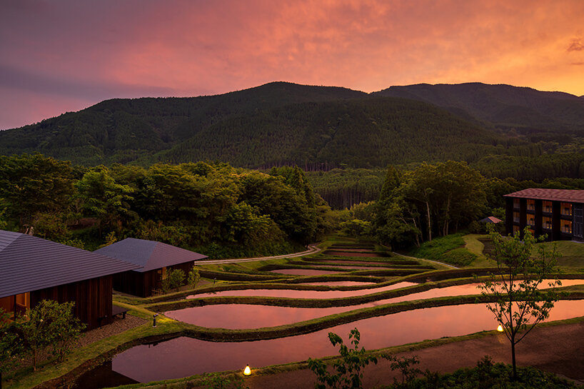 kengo kuma scatters hot spring hotel across sculpted rice terraces
