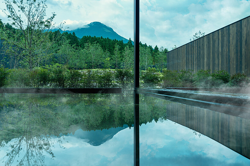 kengo kuma scatters hot spring hotel across sculpted rice terraces