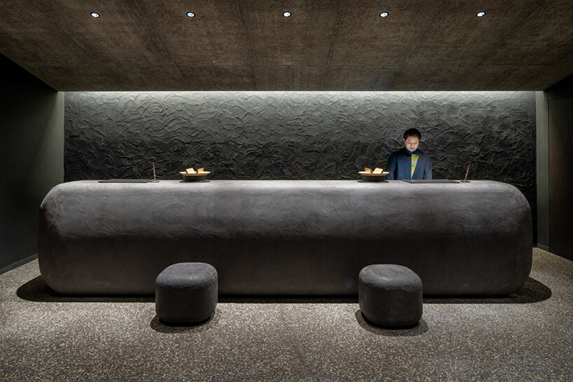 kengo kuma scatters hot spring hotel across sculpted rice terraces