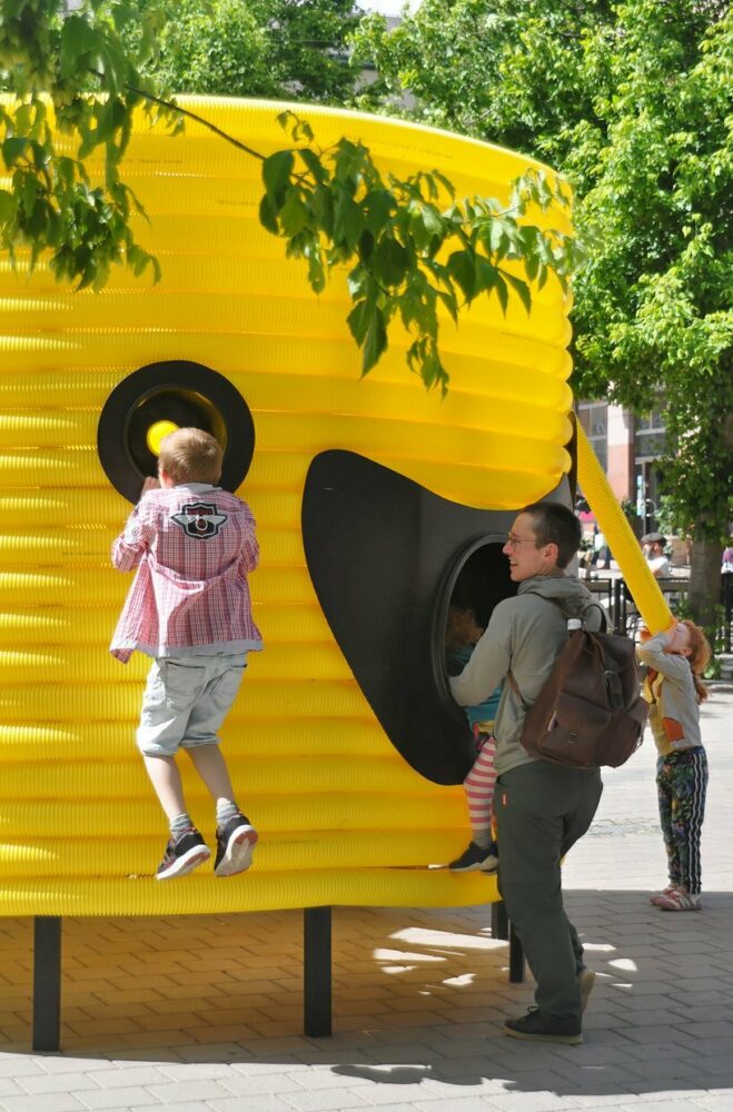 moradavaga’s giant yellow characters are acoustically interconnected in square in sweden