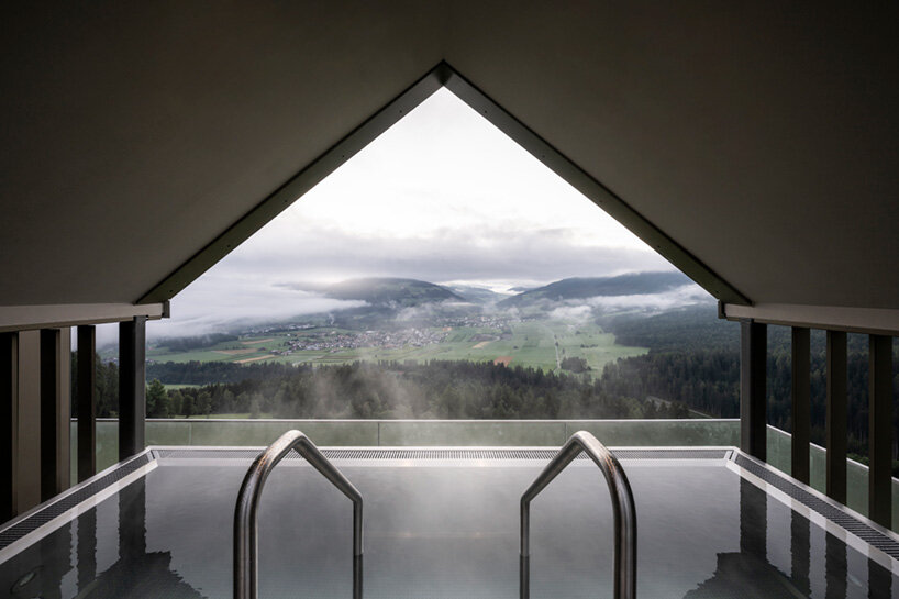 noa* defies gravity in the dolomites with its inverted ‘hub of huts’ spa