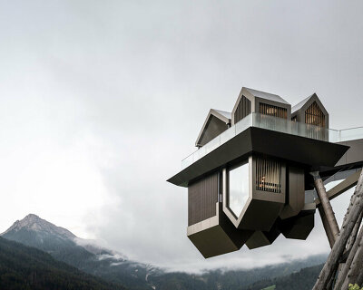 noa* defies gravity in the dolomites with its inverted 'hub of huts' spa