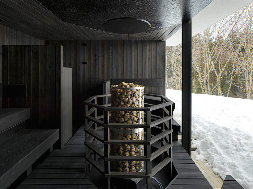 kengo kuma’s firewood roof for ‘snow peak’ spa resort echoes mountain ridgeline in japan