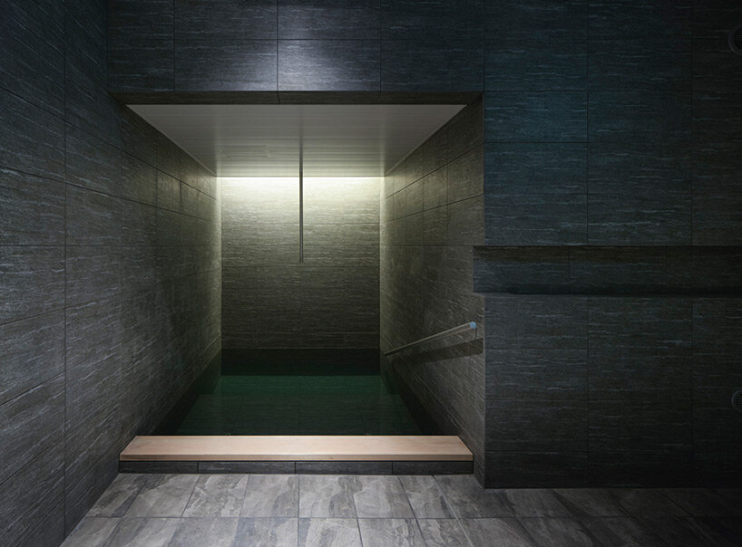 kengo kuma’s firewood roof for ‘snow peak’ spa resort echoes mountain ridgeline in japan