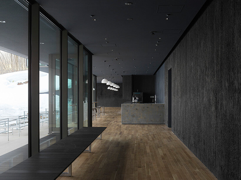 kengo kuma’s firewood roof for ‘snow peak’ spa resort echoes mountain ridgeline in japan
