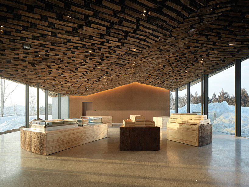 kengo kuma’s firewood roof for ‘snow peak’ spa resort echoes mountain ridgeline in japan