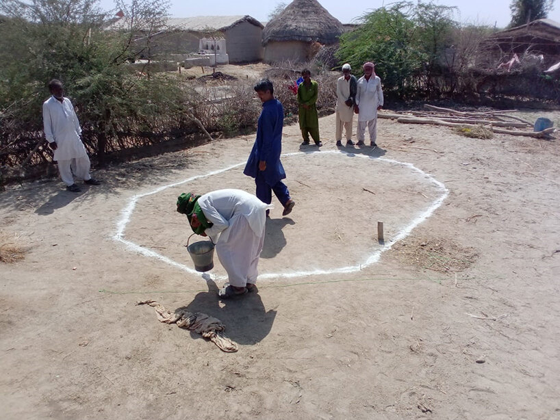 workshop: locals marking the perimeter of a shelter