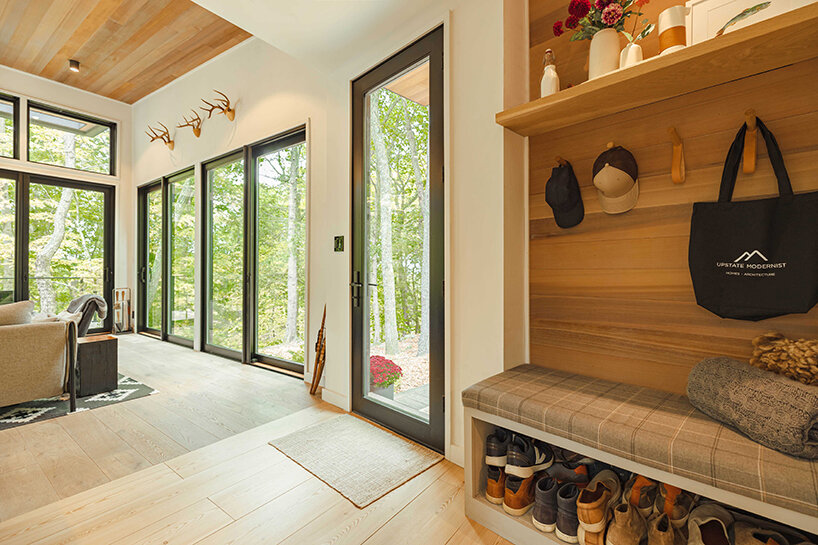 ‘cabana’ is a cantilevered, modernist retreat perched on a forest cliff in rhinebeck, NY