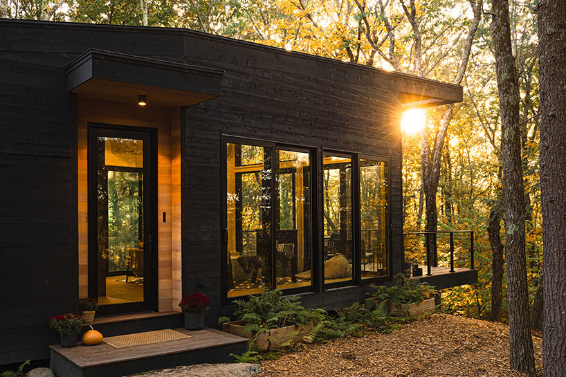 ‘cabana’ is a cantilevered, modernist retreat perched on a forest cliff in rhinebeck, NY