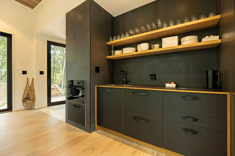 ‘cabana’ is a cantilevered, modernist retreat perched on a forest cliff in rhinebeck, NY