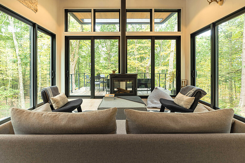 ‘cabana’ is a cantilevered, modernist retreat perched on a forest cliff in rhinebeck, NY