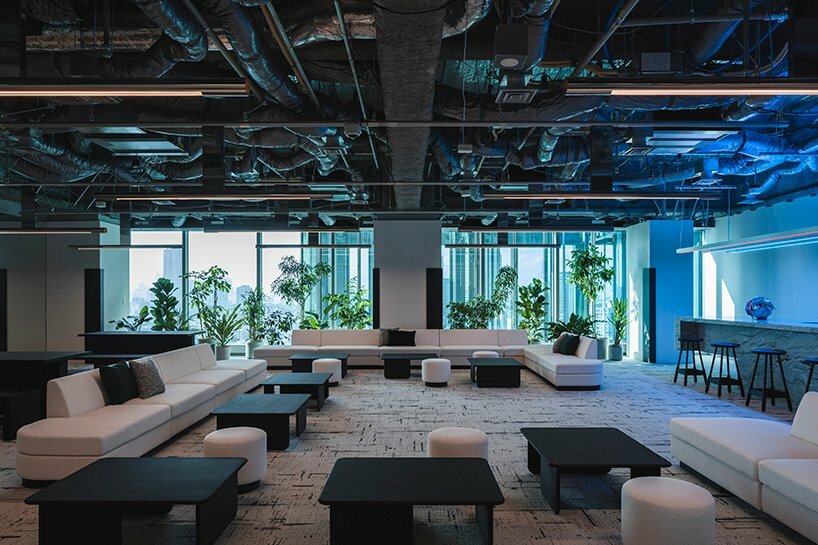 minimal lines & radiant fluorescent lighting enliven I IN’s futuristic office in tokyo