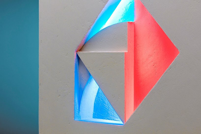 minimal lines & radiant fluorescent lighting enliven I IN’s futuristic office in tokyo