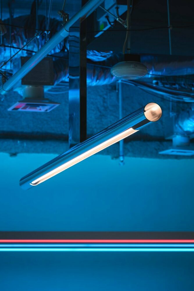 minimal lines & radiant fluorescent lighting enliven I IN’s futuristic office in tokyo