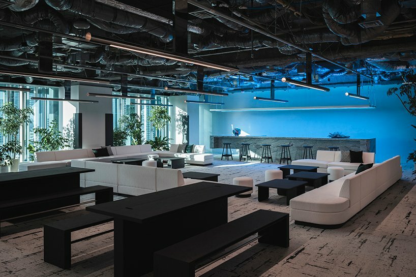 minimal lines & radiant fluorescent lighting enliven I IN’s futuristic office in tokyo