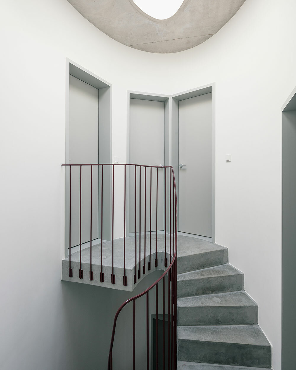 delicate lines and curves engage in visual play within minimal house in belgium - 2