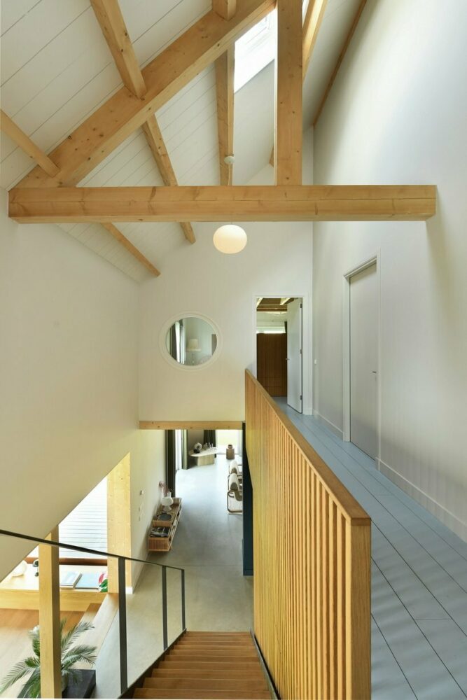 the top floor overlooks the plan through an open arrangement of space