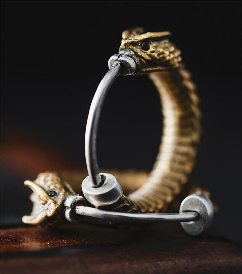 brass rattlesnake earrings by coppertist.wu embody ancient symbol of hope + eternity