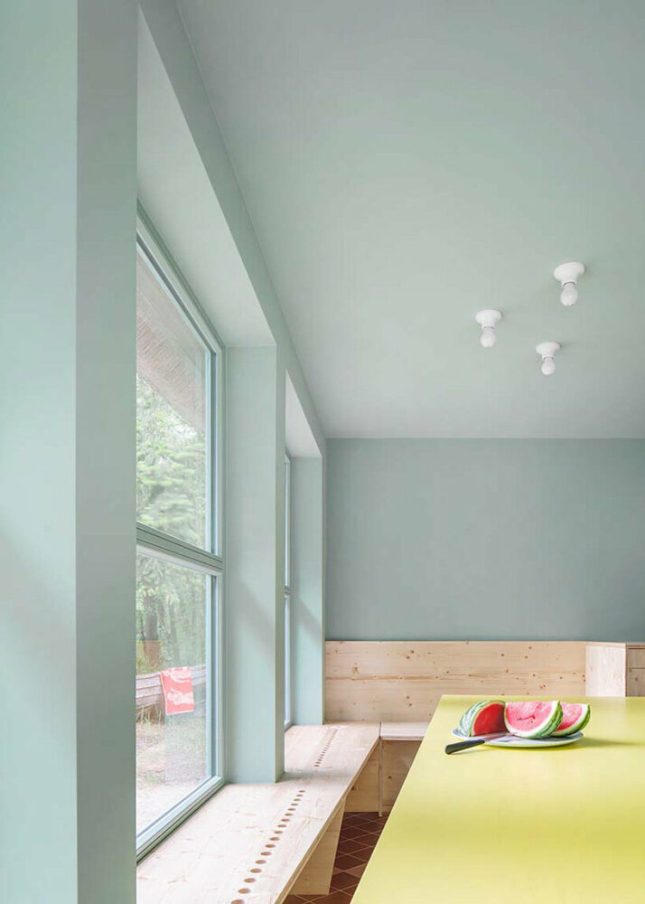 revived thatched cottage by keßler plescher architekten creates a vibrant getaway along the german lakeside