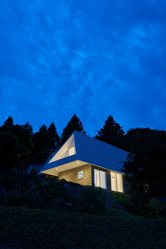 carved triangular roof frames expansive panoramas of rural Japan