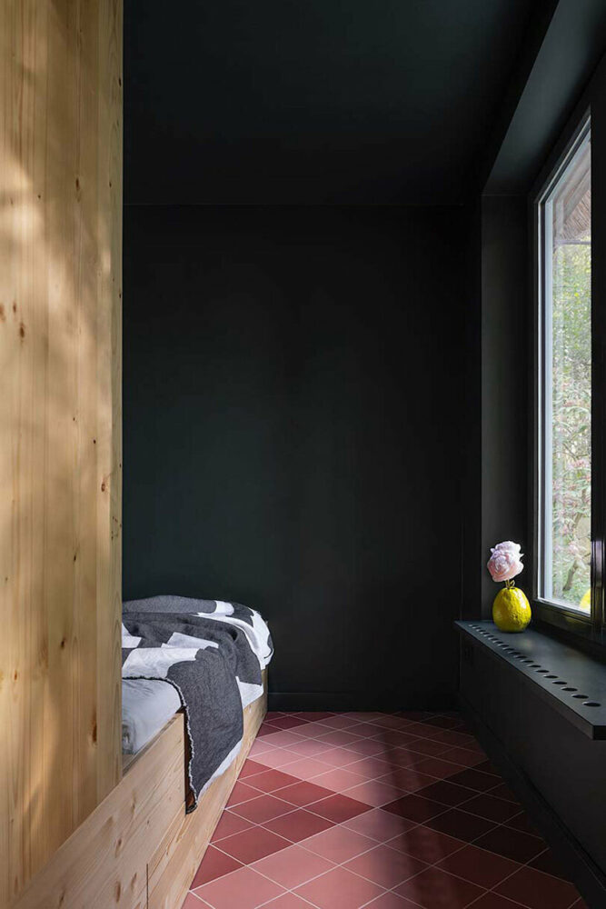 a darker color palette for the bedrooms emphasizes the greens of the landscape outside