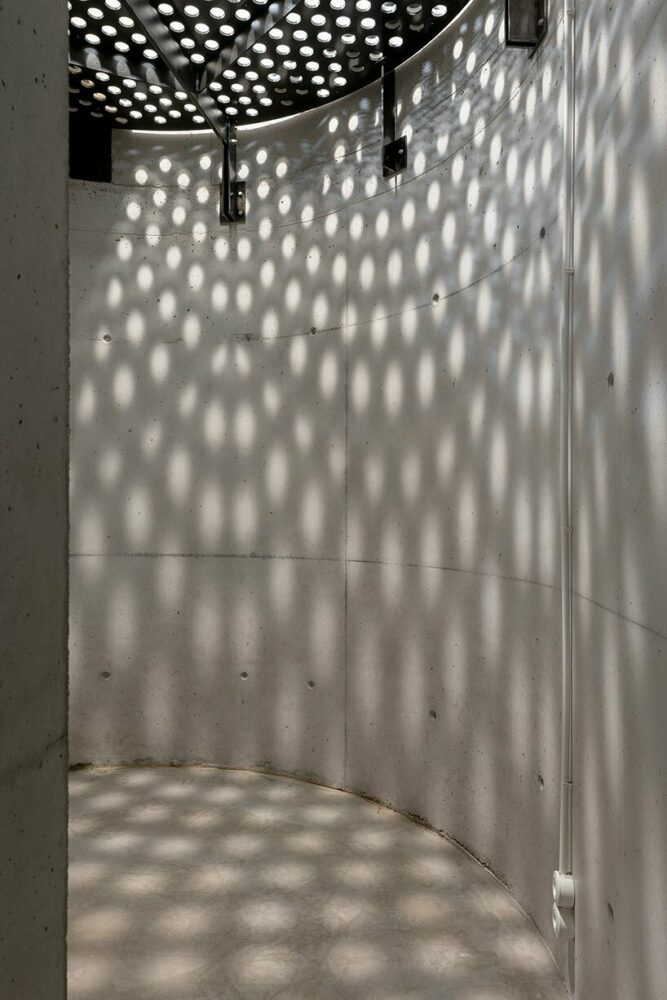 shadows on the basement's curvy concrete walls
