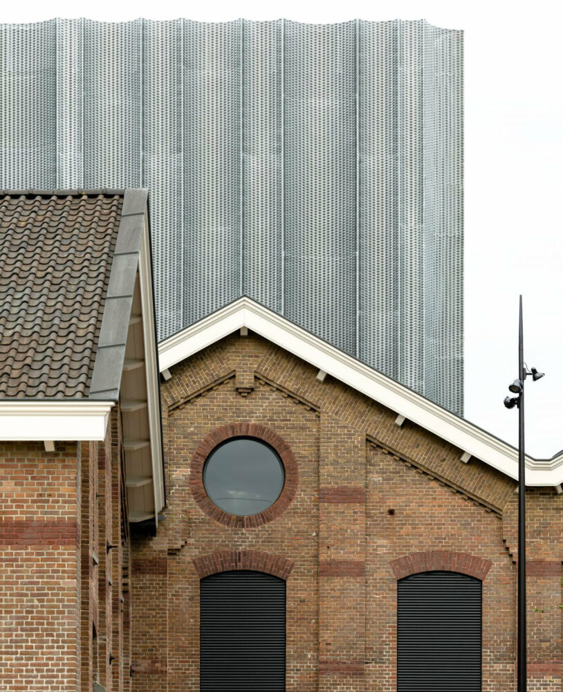 heavy gear workshop renovation exposes massive steel curtain in utrecht