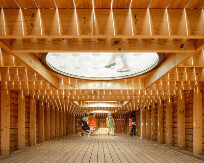 geometric activity pods welcome young students into renovated school playground in spain