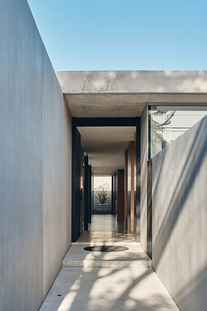 with layered volumes, FGR architects’ ‘courtyard house’ evokes a minimalistic labyrinth