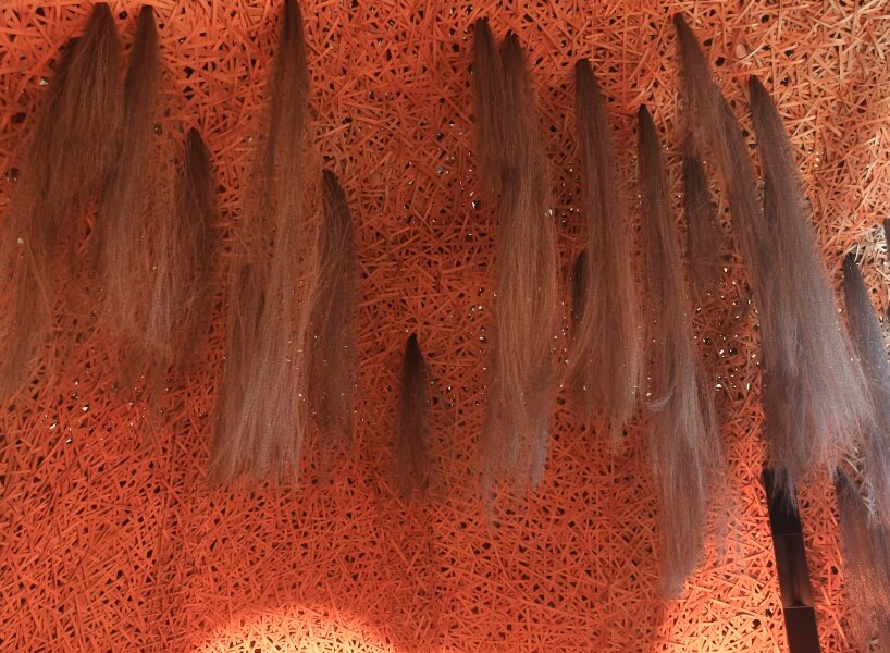 Hermès weaves a garden of life-size bamboo caves from recycled brushes in qatar - 6