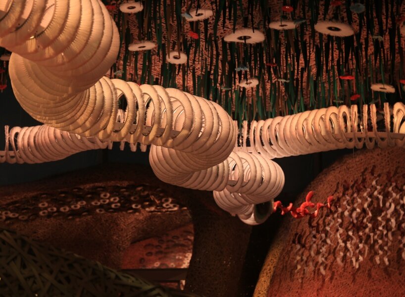 Hermès weaves a garden of life-size bamboo caves from recycled brushes in qatar - 1