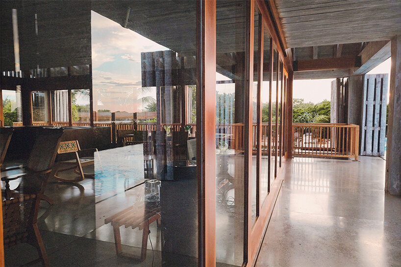 a layer of large glass frames reveals the residence