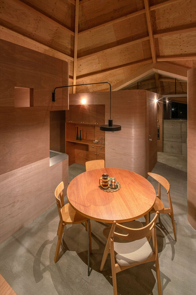 UID architects tops octagonal japanese home with a spiderweb-shaped roof