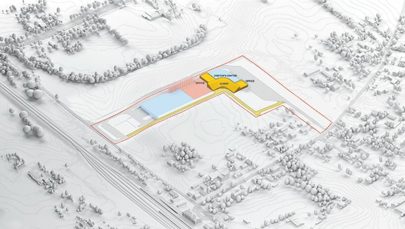 the upper floor office and visitor center are accessible from a pedestrian route next to the fields of corn