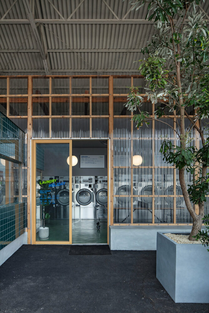 the exterior terrace is furnished with concrete benches and planters