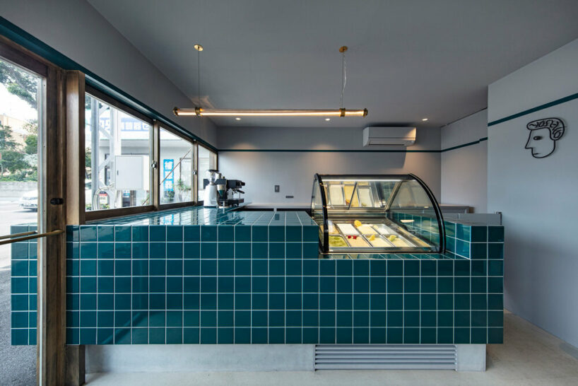 the deep green tiling spills over the ice cream shop's counter