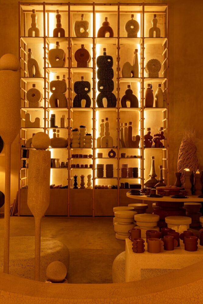 natural textures and earth tones wrap each surface of cavernous la nena cafe in dubai