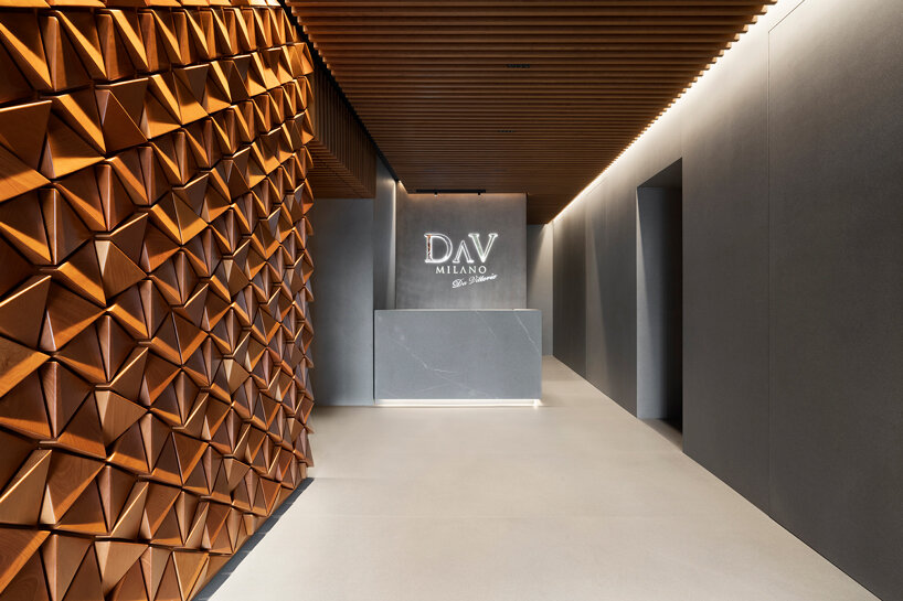 andrea maffei architects clads milan's DAV restaurant interior in pyramid wooden panelling