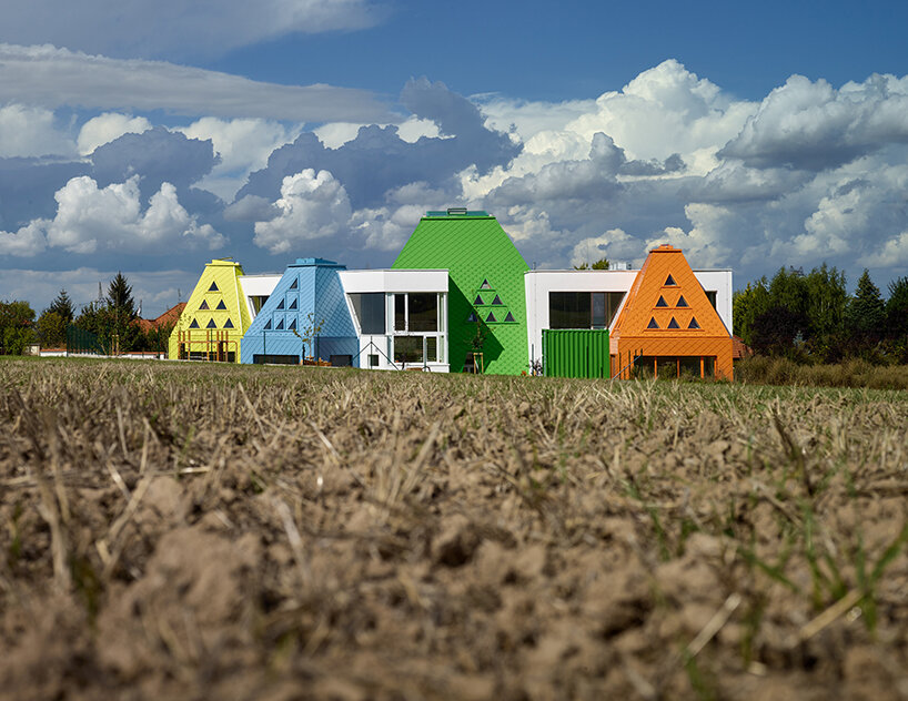 protruding, colored 'sheds' envelop architektura's kindergarten design in czechia - 1