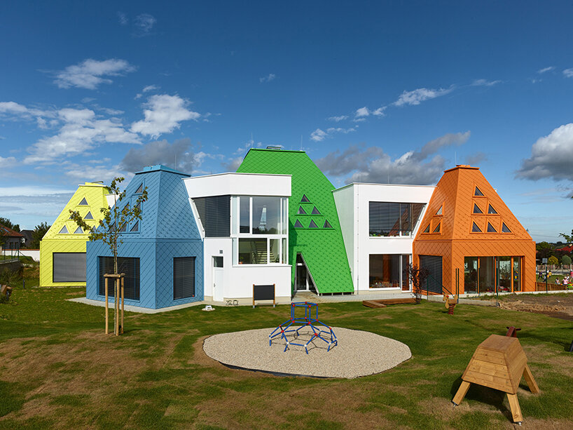 protruding, colored 'sheds' envelop architektura's kindergarten design in czechia - 2