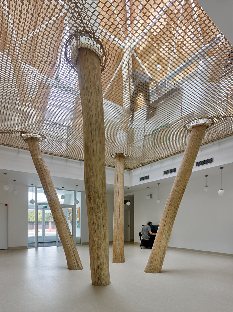 protruding, colored 'sheds' envelop architektura's kindergarten design in czechia - 6