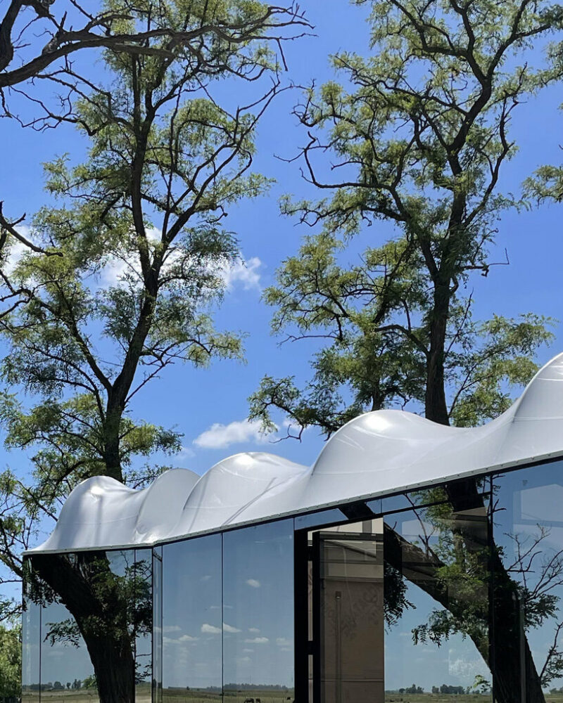 DUB arquitectura tops its ‘atelier-A’ with an undulating roof of translucent fabric