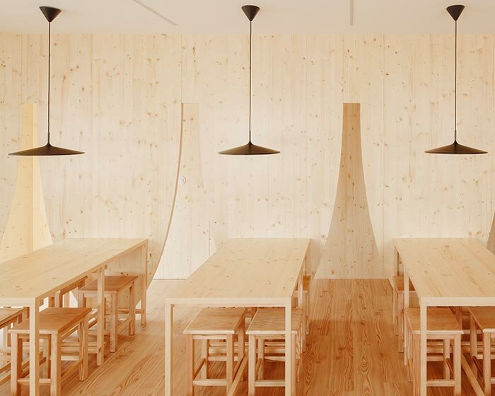funnel-shaped cutouts finish snug restaurant in portugal