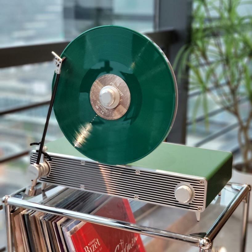 sleek vertical turntable brings bold colors & vintage mood to any room