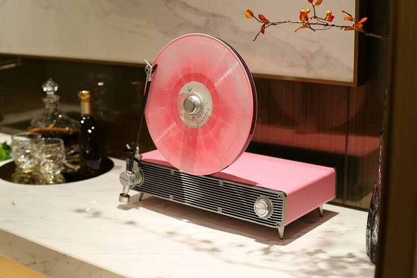 sleek vertical turntable brings bold colors & vintage mood to any room