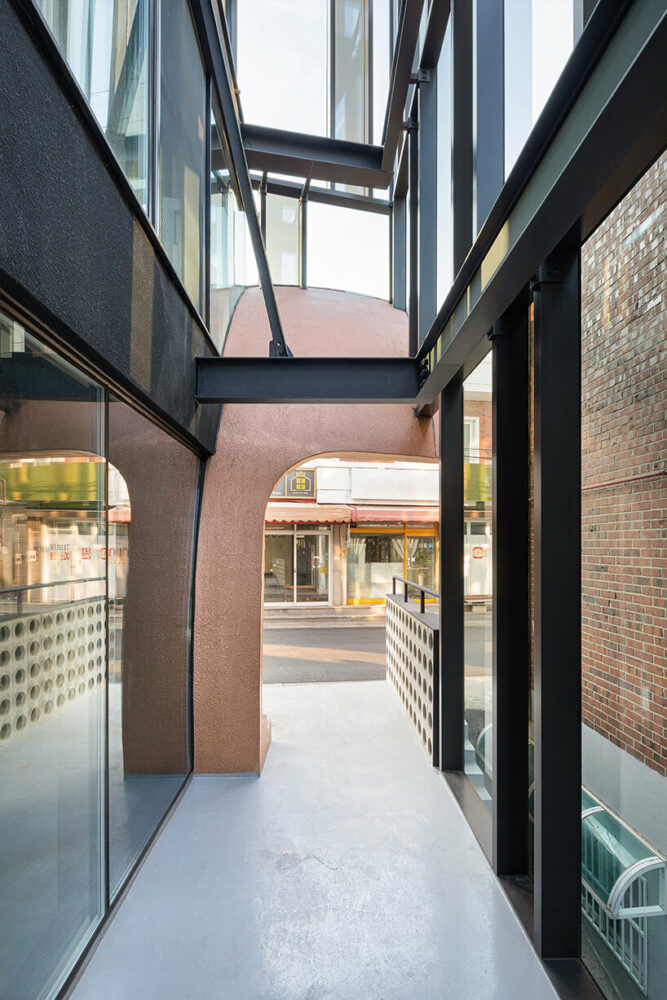 concrete cuts and curves pierce through moon hoon-renovated building in seoul