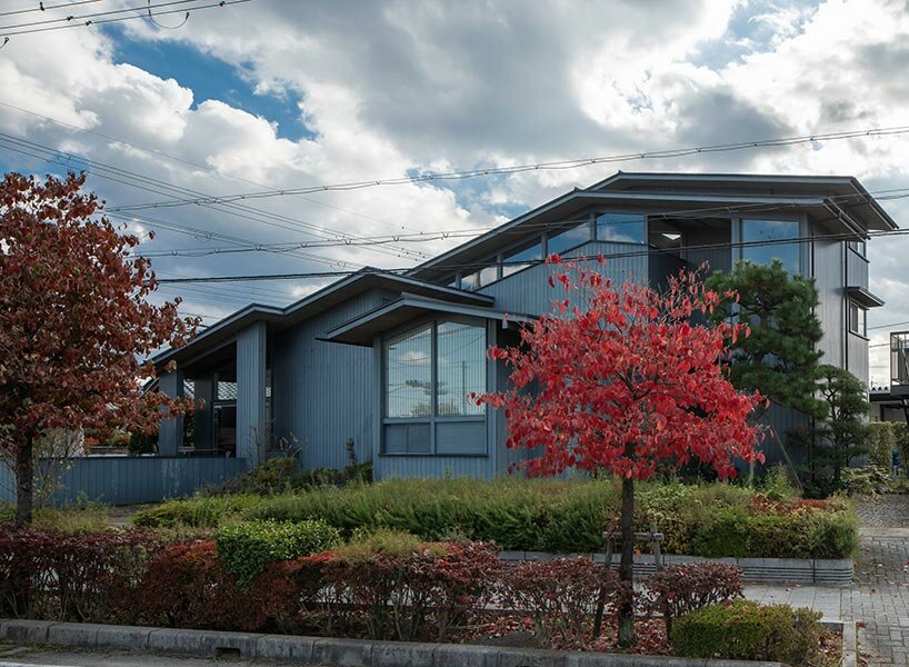 overlapping gable roofs afford openness for 'leading house' by FORM kouichi kimura architects