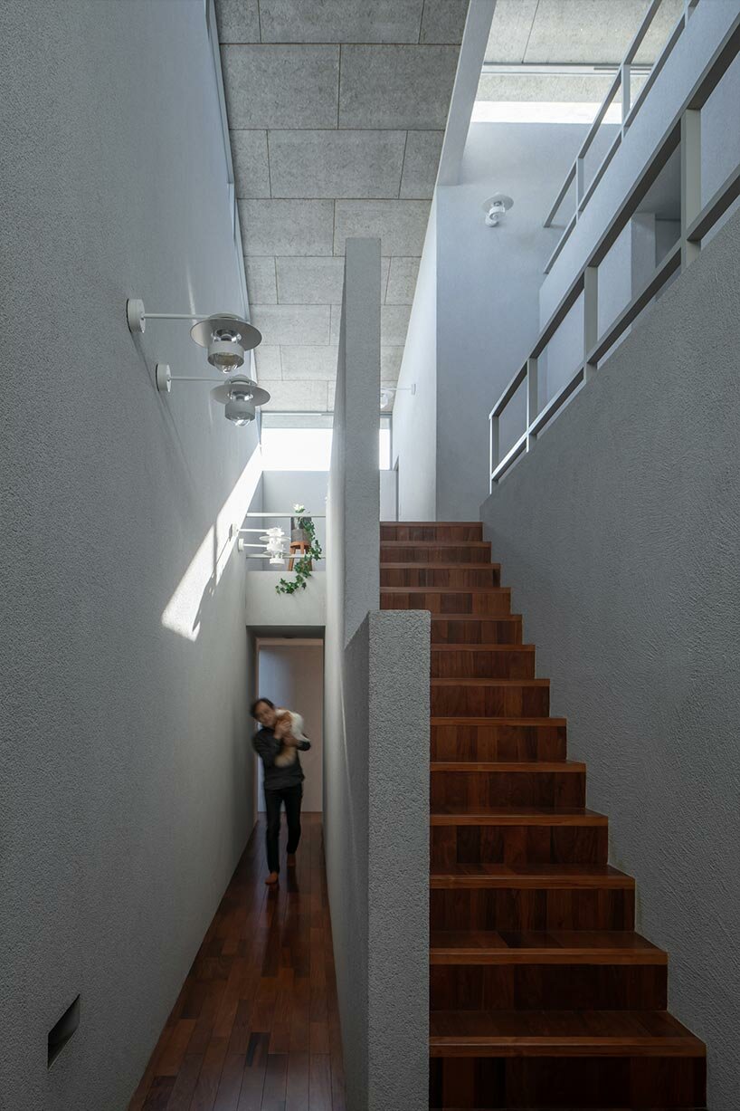 overlapping gable roofs afford openness for 'leading house' by FORM kouichi kimura architects