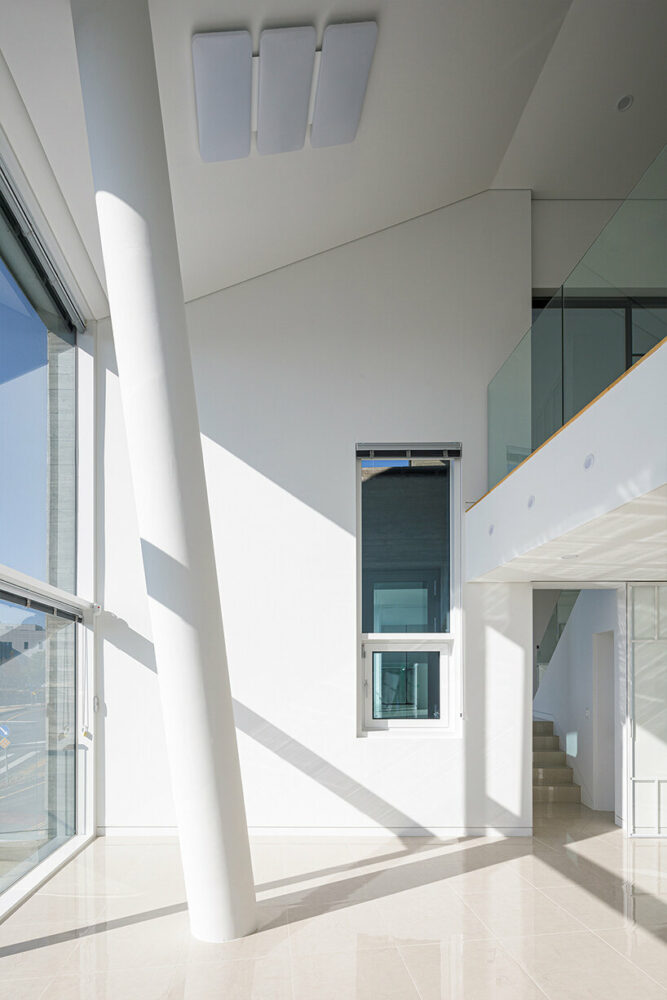 moon hoon stacks concrete volumes to build rock-shaped dwelling in south korea